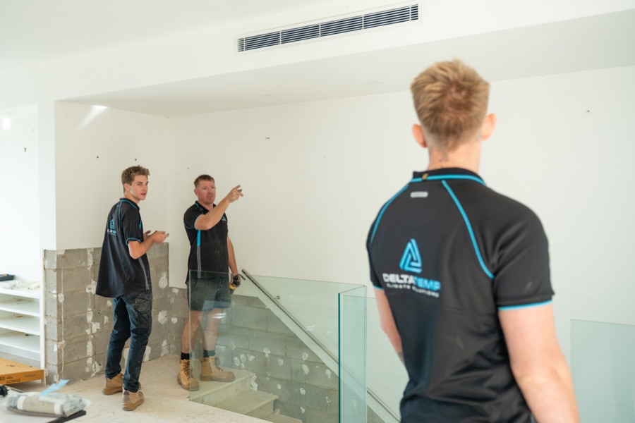 Delta Temp team in a new build with a linear ducted diffuser in the ceiling