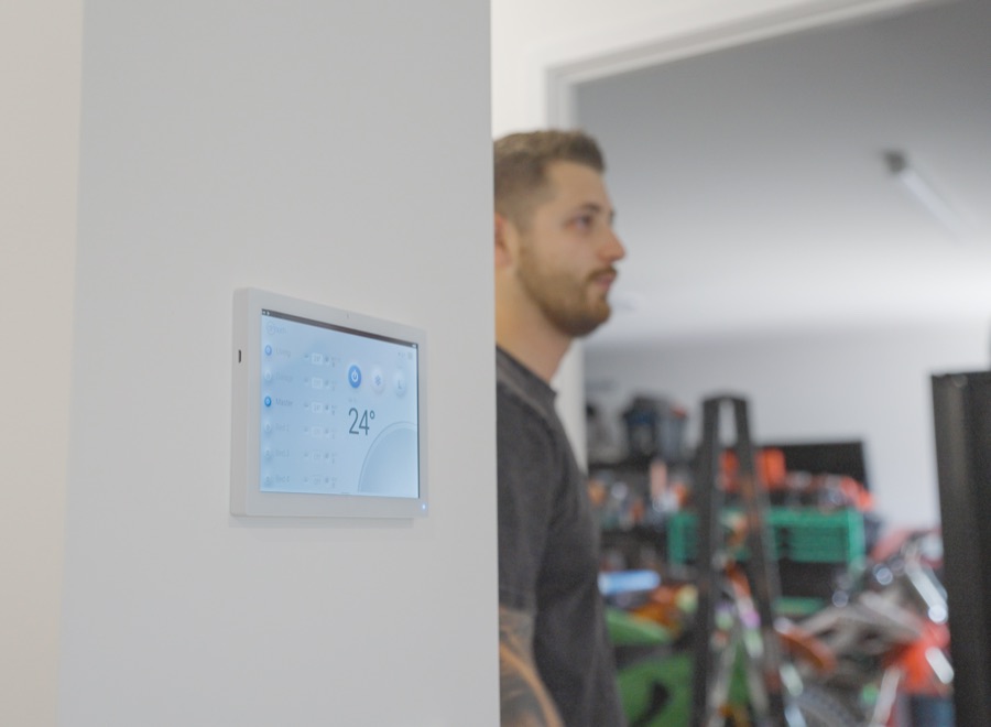 Wall mounted zone controller touchscreen showing 24 degrees