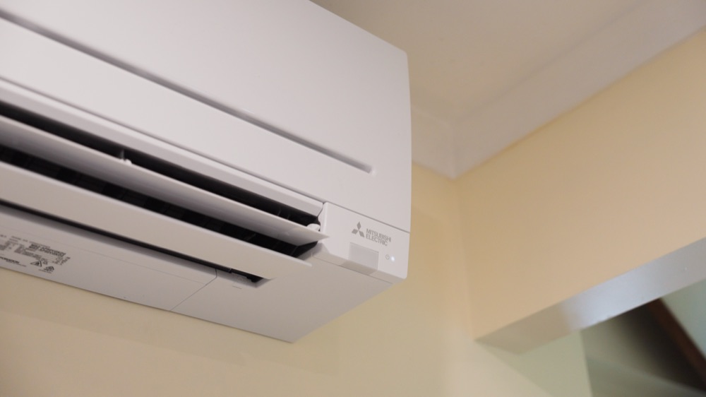 A wall mounted split system in a living area