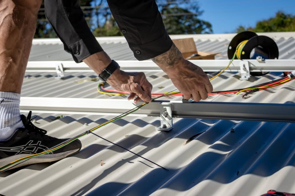 Solar racking being fixed to a roof